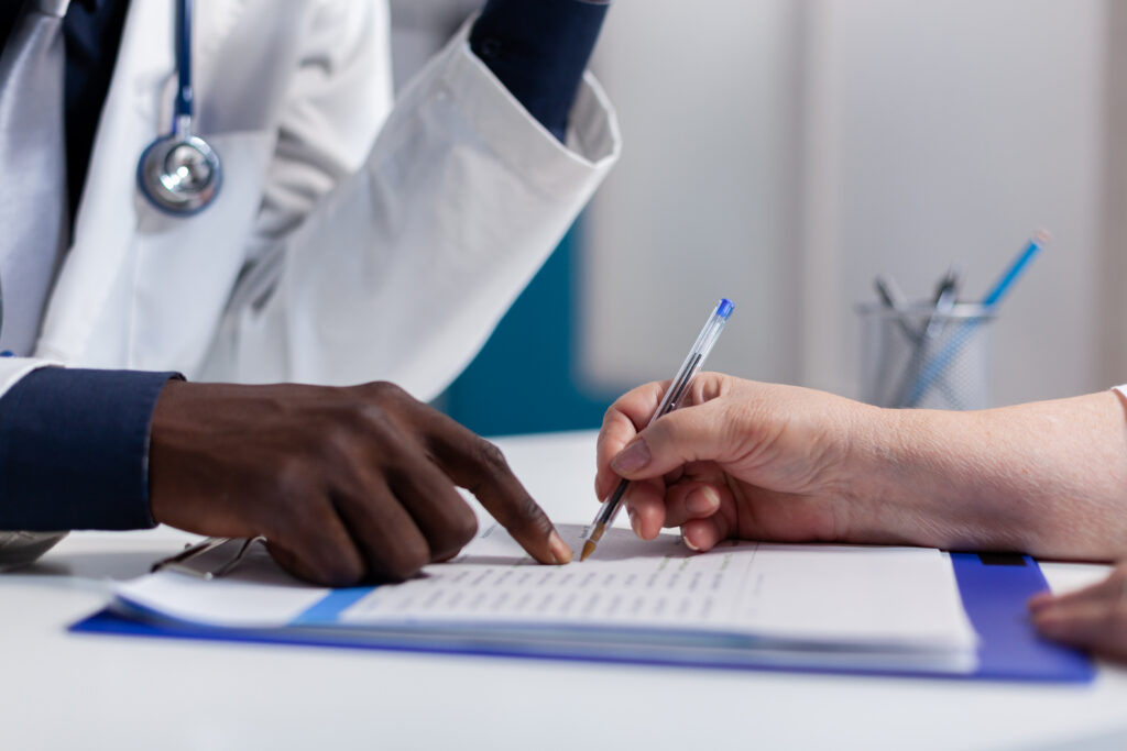close up of hands on desk at healthcare clinic